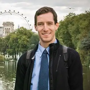 Ben Rogers wearing a tie in England with the London Eye in the background